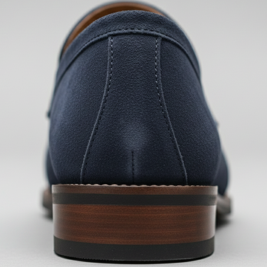 Back details of the navy suede penny loafers with orange trim, featuring a classic design for formal and casual occasions.