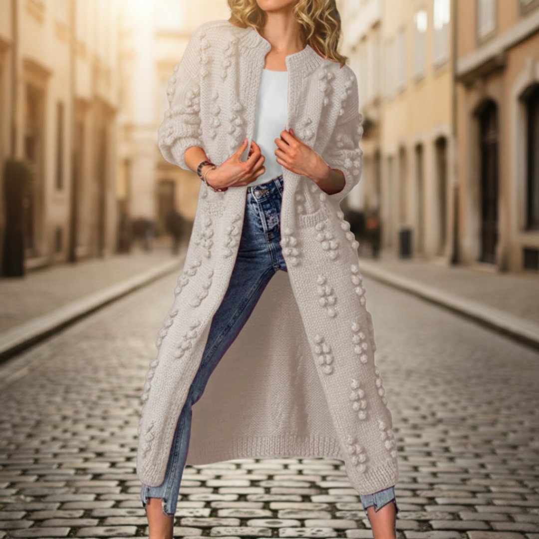 A woman in a beige cardigan, embodying with a soft, open-front duster for fall and winter.