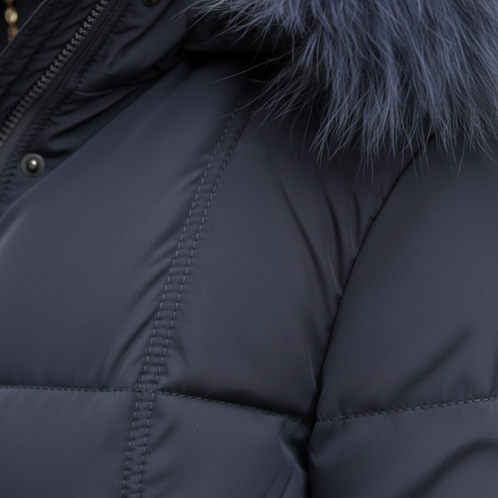Close-up look of a grey coat with fur trim, embodying winter fashion.