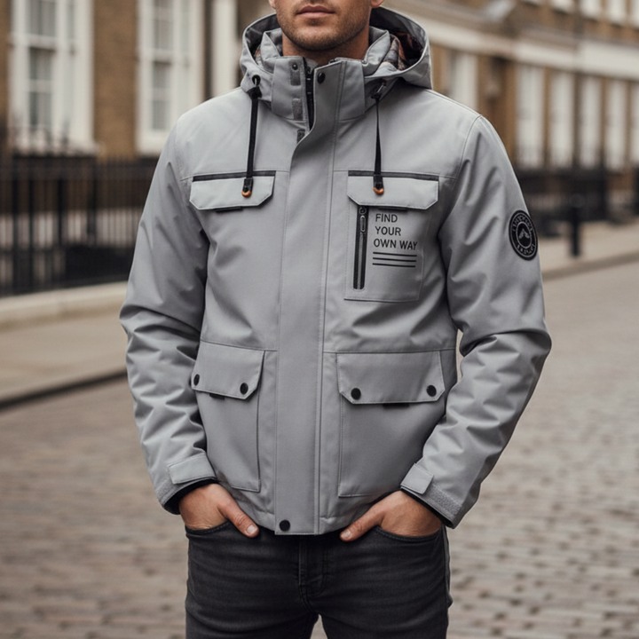  Men's waterproof jacket with hood, multiple pockets, and reflective detailing, ideal for fall and spring weather.