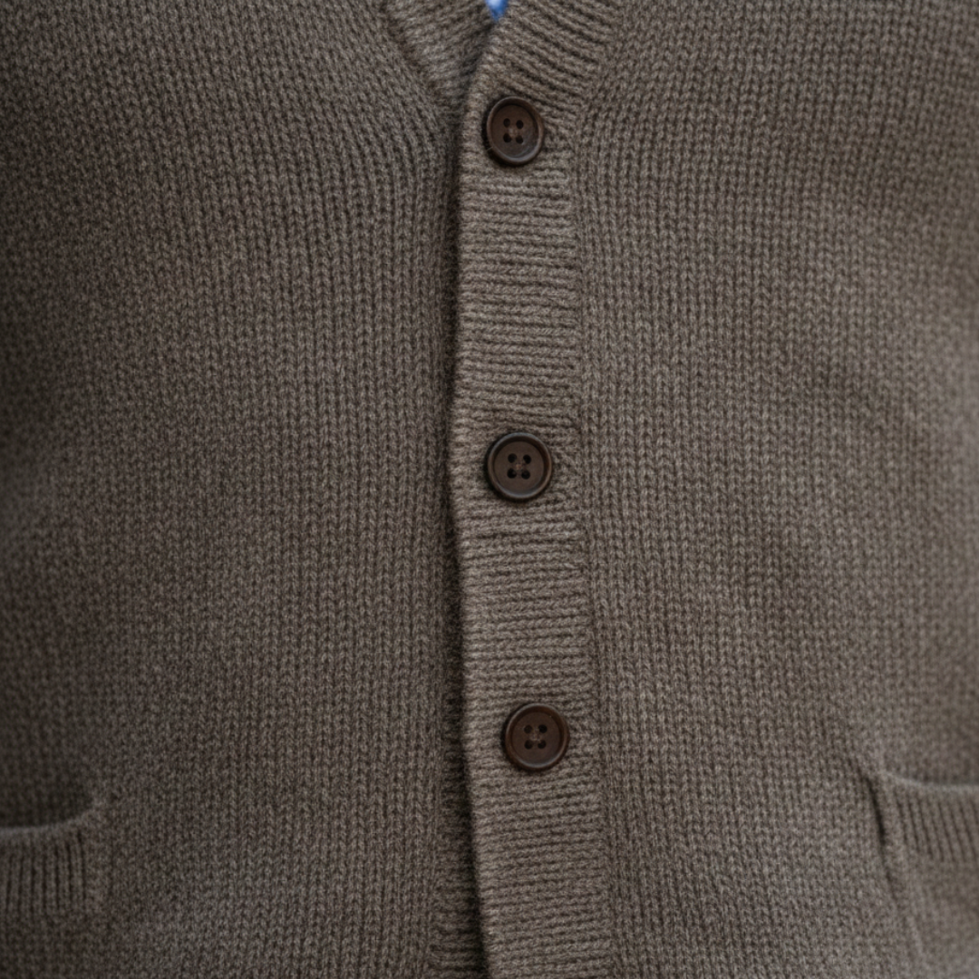  a brown vest over a blue shirt, showcasing a polished and versatile smart-casual look.
