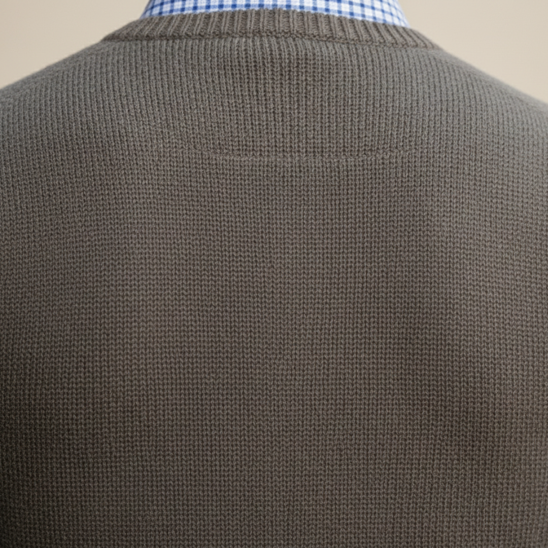  a brown vest over a blue shirt, showcasing a polished and versatile smart-casual look.