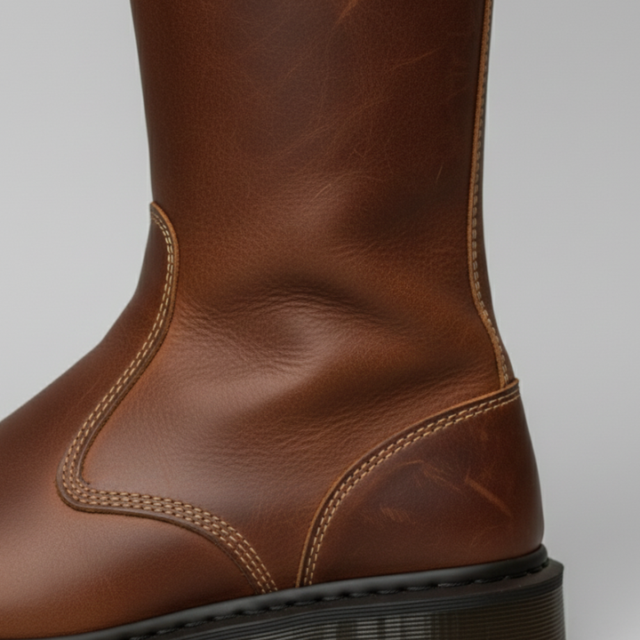 brown leather mid-calf boots, featuring a rounded toe and slip-on design, ideal for casual layered outfits.