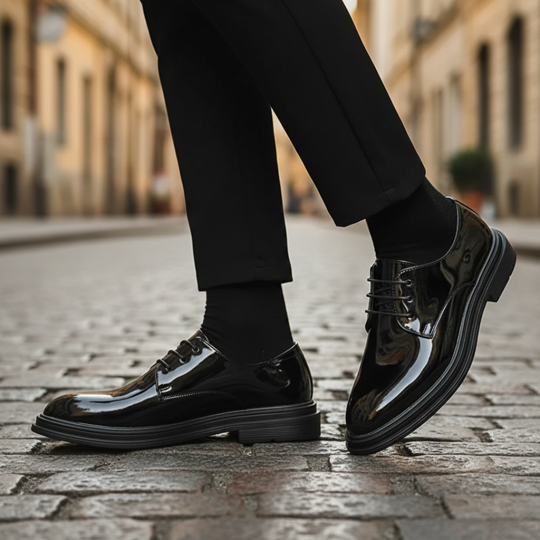 A man in a black suit and polished black shoes, it shows elegance for formal occasions.