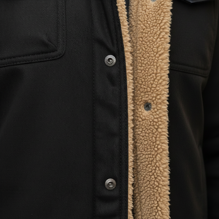 Close-up details of the black men's fleece-lined jacket with a classic shearling collar, ideal for fall and winter, combining style and warmth.