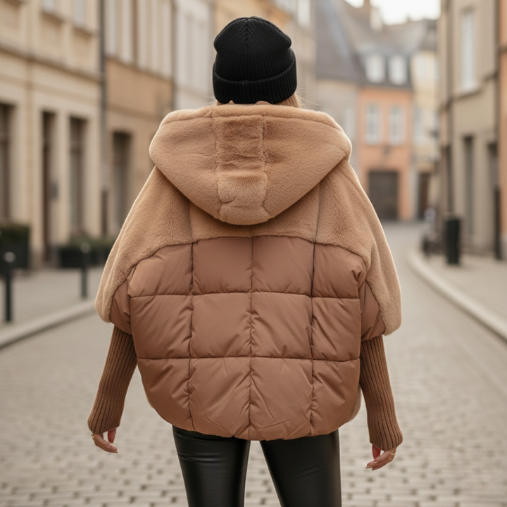 A woman wearing a brown coat, showcasing a stylish winter outfit suitable for cooler weather.