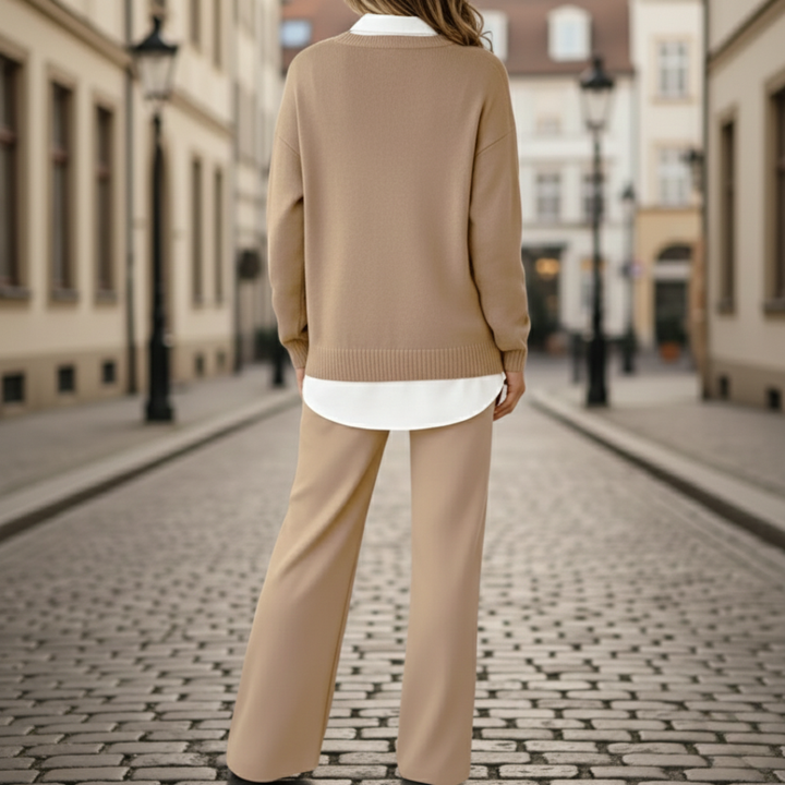 Back details of the coordinated beige sweater and pants set featuring gold-tone buttons.