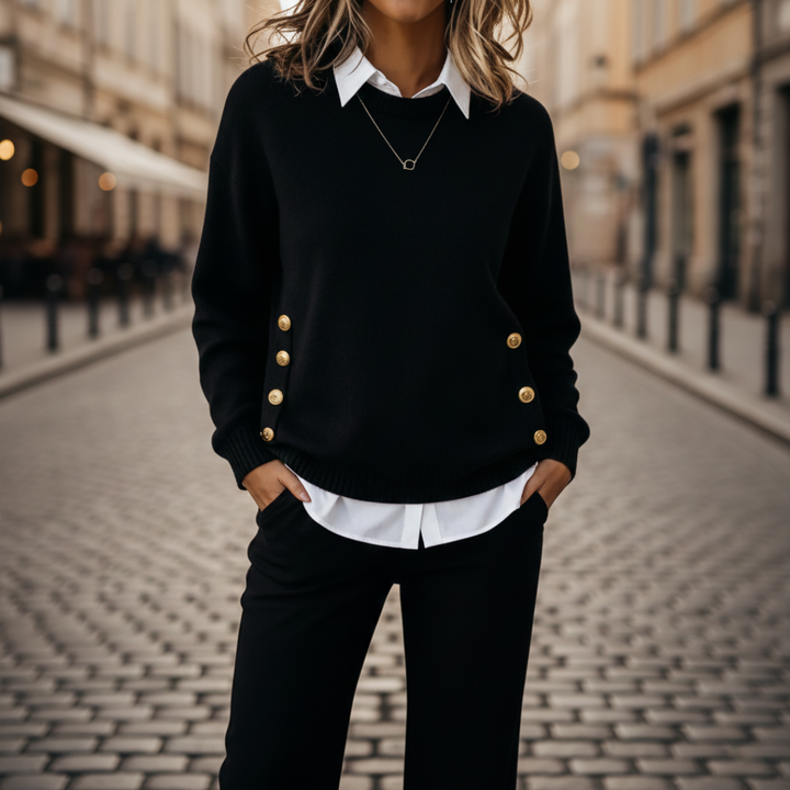 Coordinated black sweater and pants set featuring gold-tone buttons.