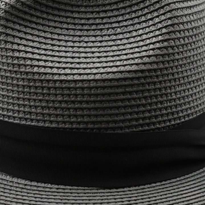 Straw hat with a pinched crown and medium-width brim, featuring a black grosgrain ribbon band for a polished look.