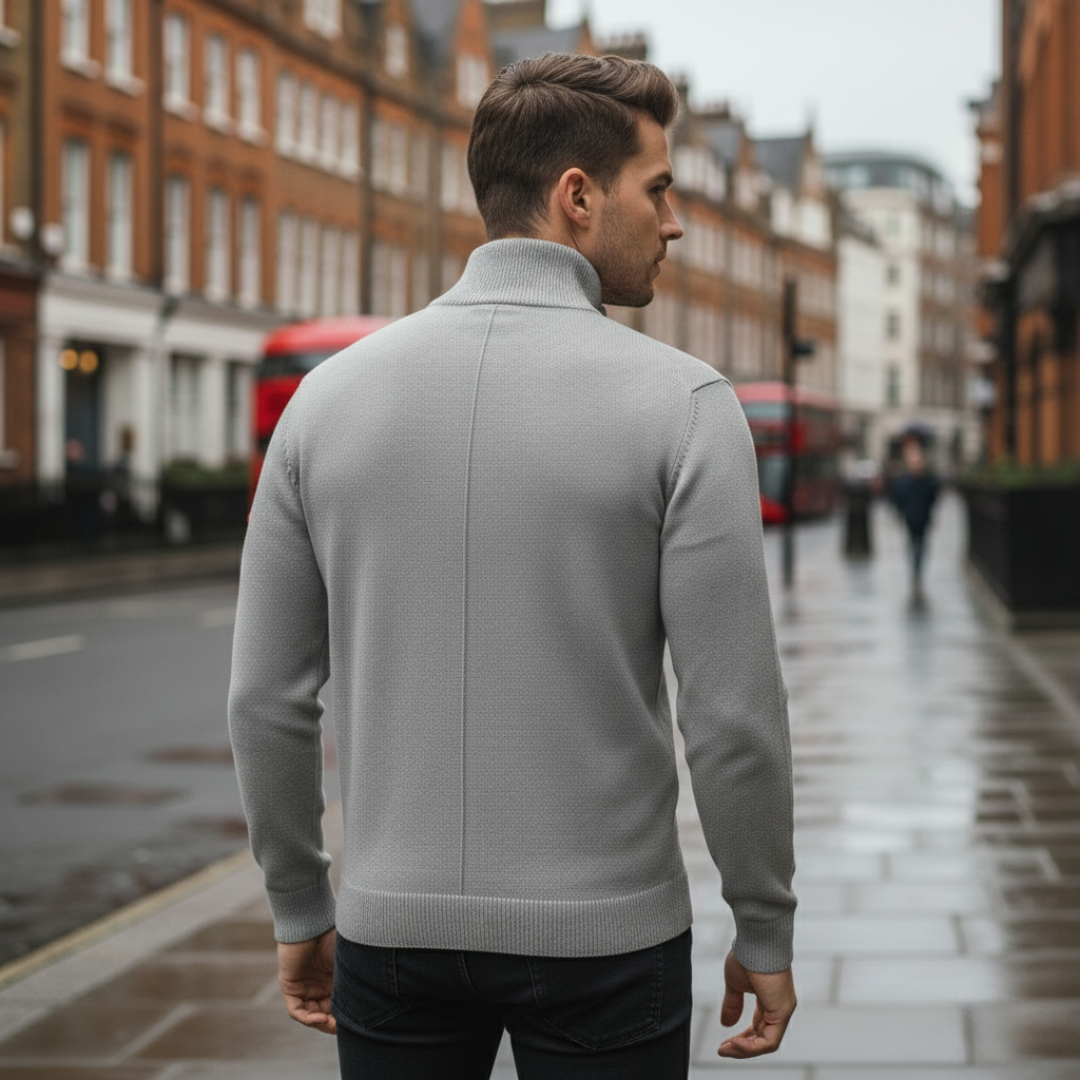 Back details of a man wearing a grey half-zip sweater, showcasing a casual style for fall and winter.