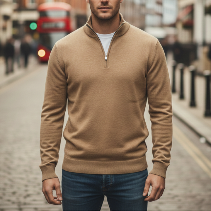 A man wearing a beige half-zip sweater, showcasing a casual style for fall and winter.