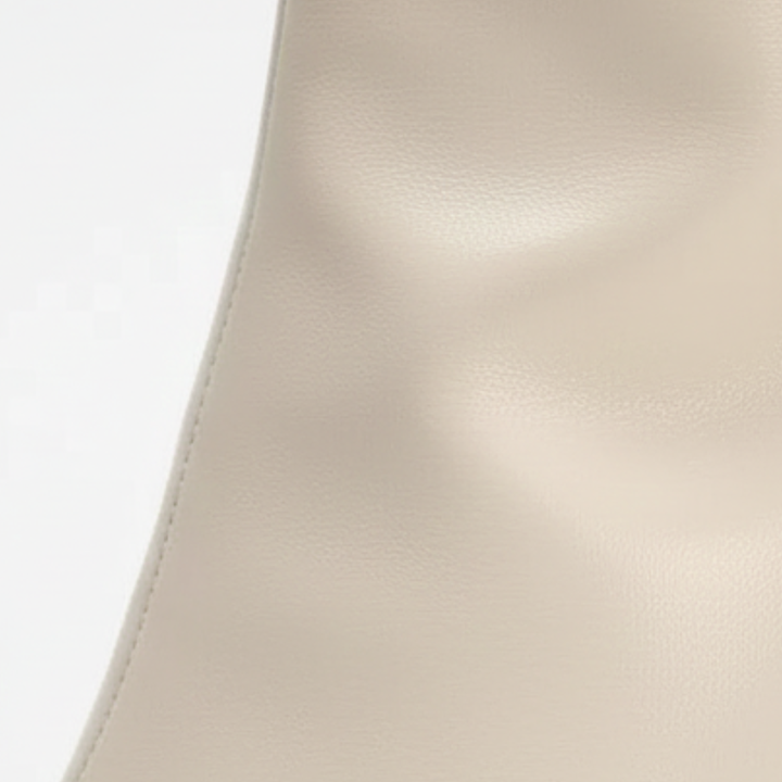 sleek white knee-high boots with a pointed toe and elegant stiletto heel.