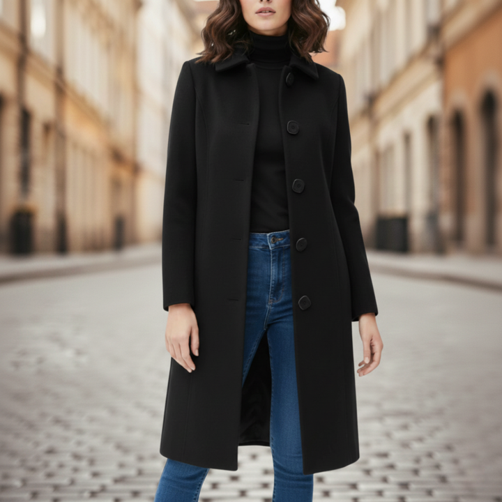 a black tailored coat paired with jeans, good for everyday wear in fall and winter.